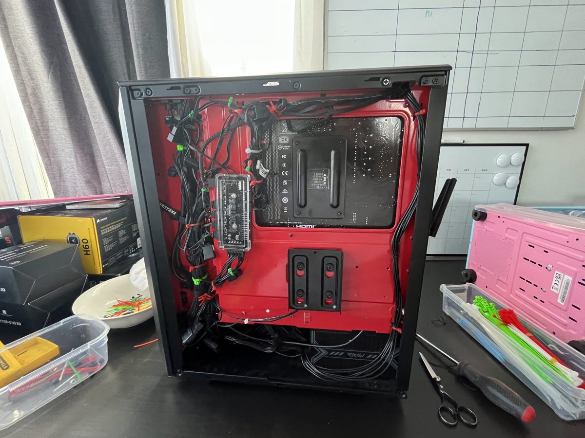 The back of a PC build with tidy, cable-tied wiring